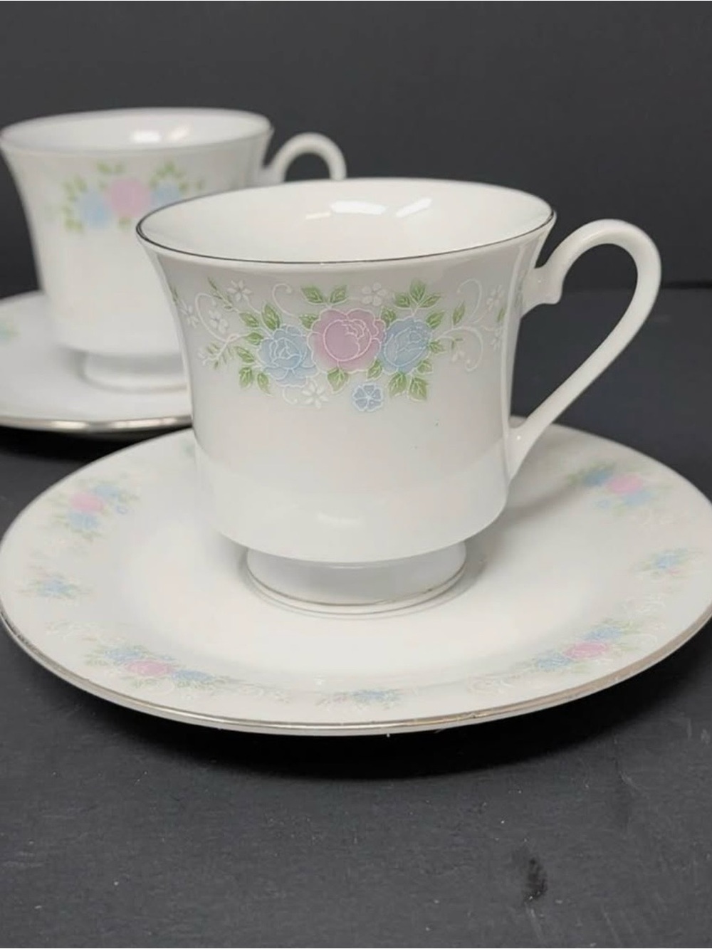Vintage Elegant White Fine China Teacup and Saucer with Pastel Floral Design